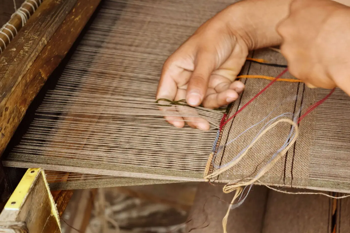 Textile production scene showing technical fabric coating and finishing workflow